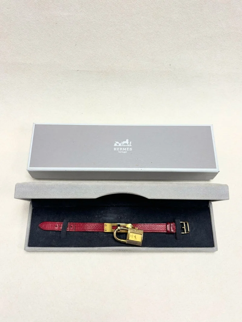 Hermès Kelly - Padlock watch in gold-plated metal and leather