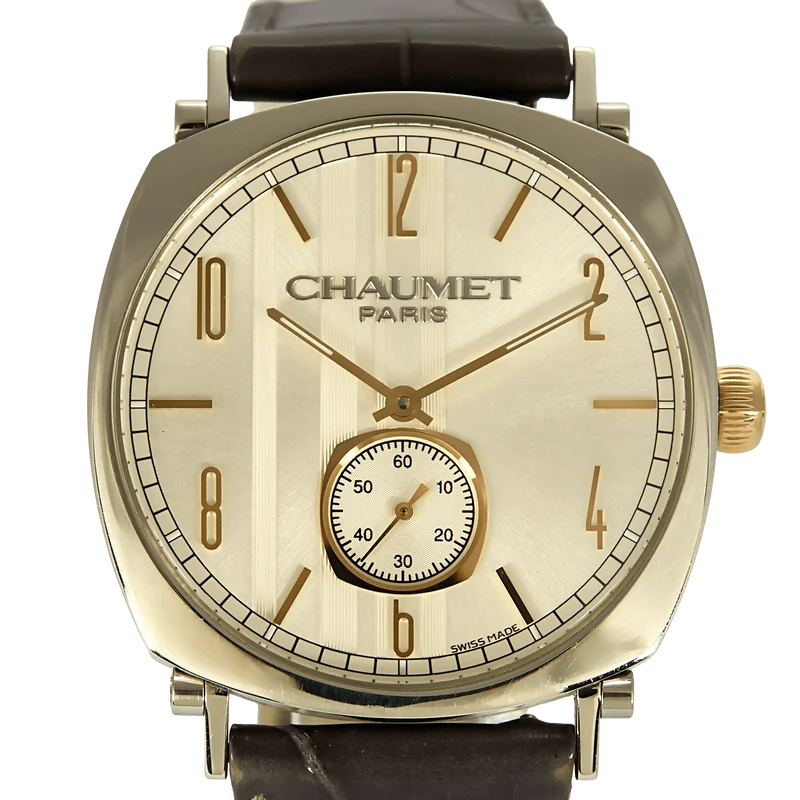 CHAUMET - DANDY - Steel watch, gilded steel, tonneau-shaped case and mechanical movement