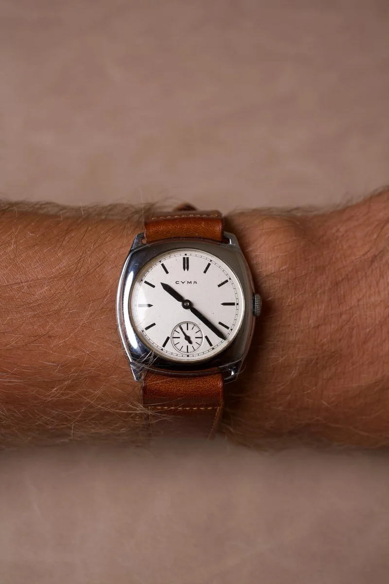 Cyma - Steel cushion watch, white dial, 1940s